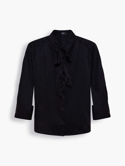 Satin Shirt with Necktie in Midnight Black. This flattering black shirt is cut in a tailored yet relaxed fit, a design you can wear comfortably all day. It has a curved hem, perfect for the half tuck and comes with a necktie. Create a statement look with the matching satin skirt and a sculptural accessory.